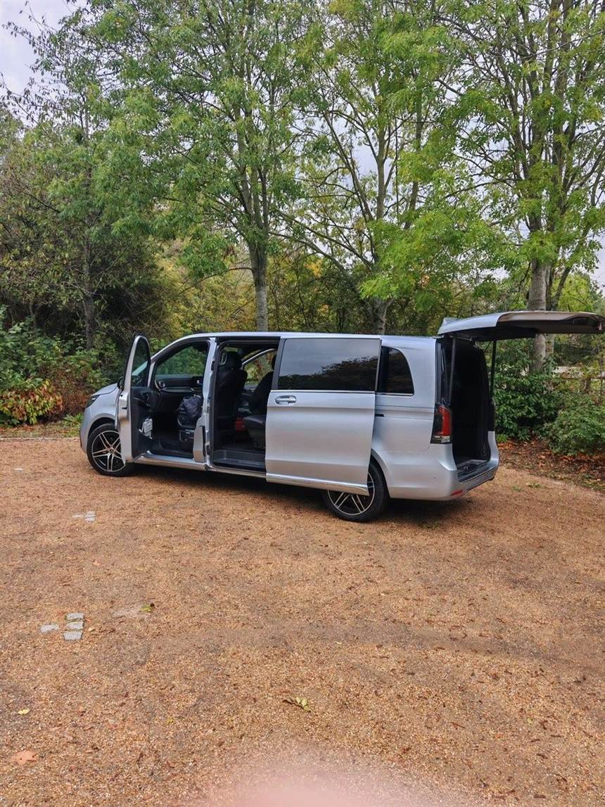 The V-Class Extra Long with both sliding doors and the tailgate open, showing the rear cabin