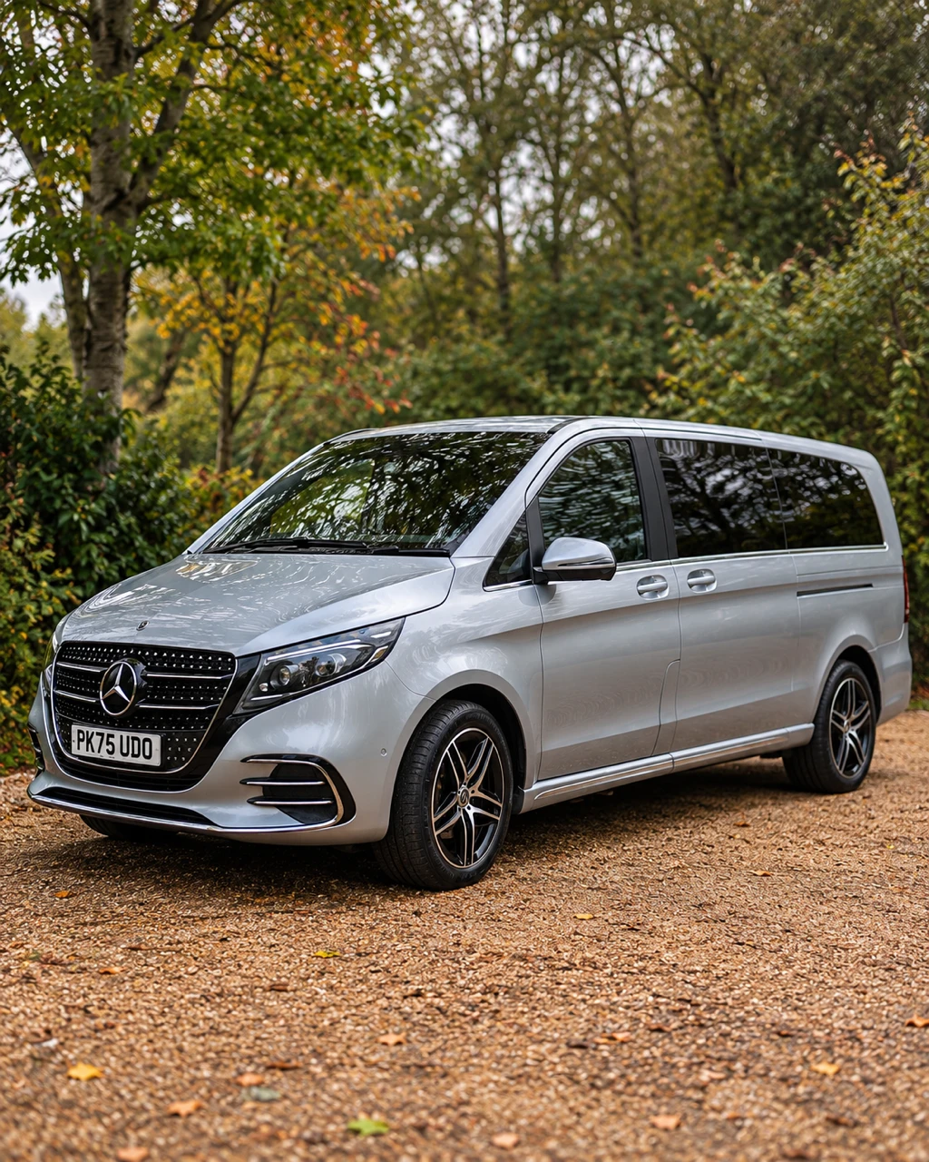 Streamline's new silver Mercedes V-Class Extra Long on a tree-lined gravel drive